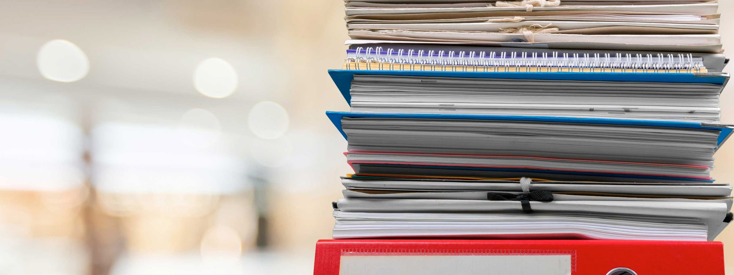 binders stacked on a table